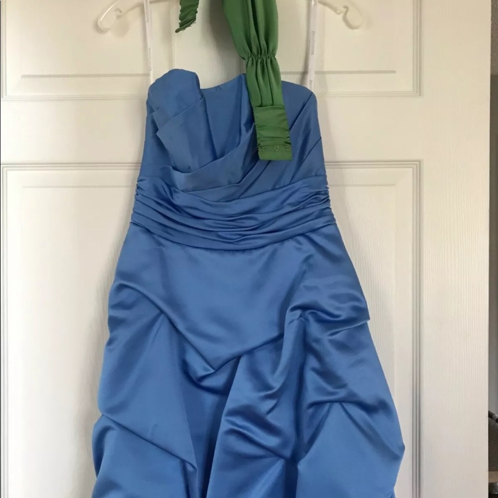Short blue, strapless dress with green belt